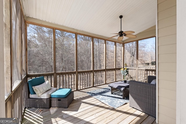 sunroom / solarium with lofted ceiling and ceiling fan