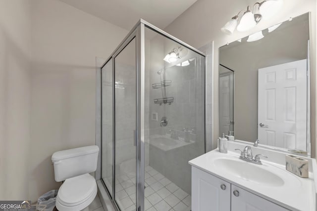 bathroom with toilet, a stall shower, vanity, and tile patterned floors