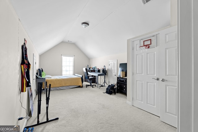 bedroom featuring lofted ceiling and light carpet