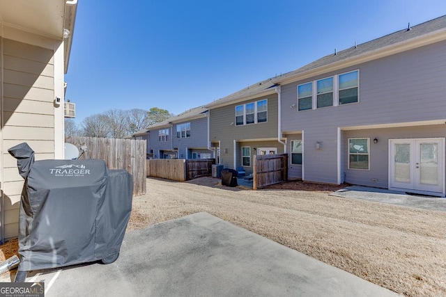 view of yard featuring central AC, a patio, and fence