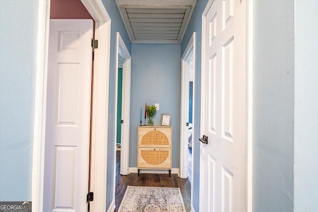 corridor featuring dark wood-type flooring