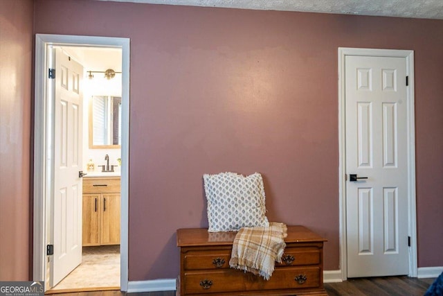 interior space featuring dark wood finished floors and baseboards