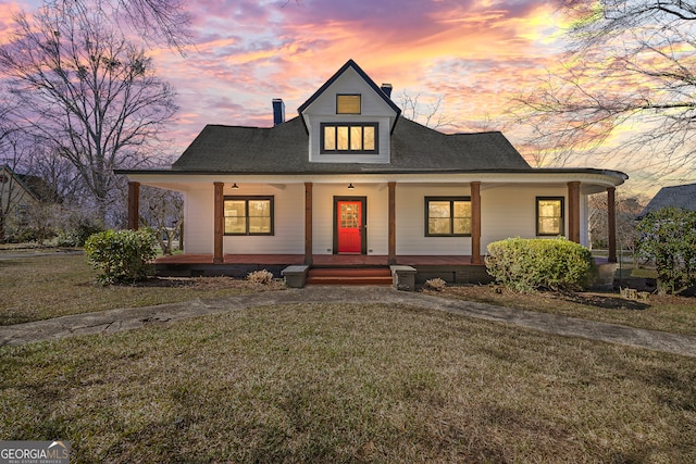 4901 Macon Hwy, Bishop, GA 30621 - view of front of house featuring a porch, a front yard, and a chimney