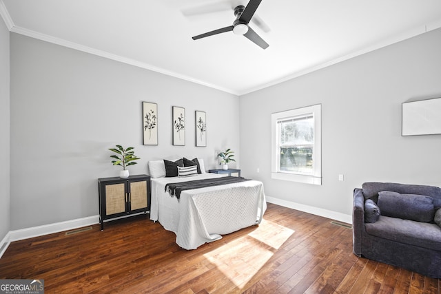 bedroom featuring baseboards, ornamental molding, and dark wood-style flooring