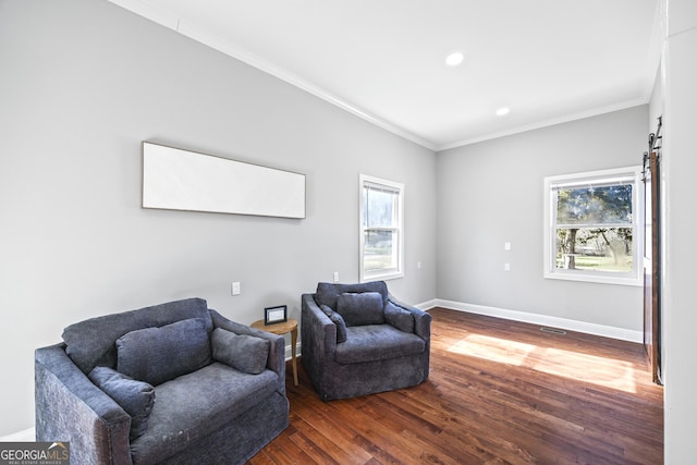 living area with recessed lighting, crown molding, baseboards, and wood finished floors