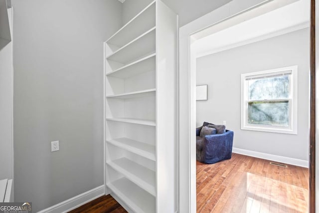 interior space featuring visible vents and wood finished floors