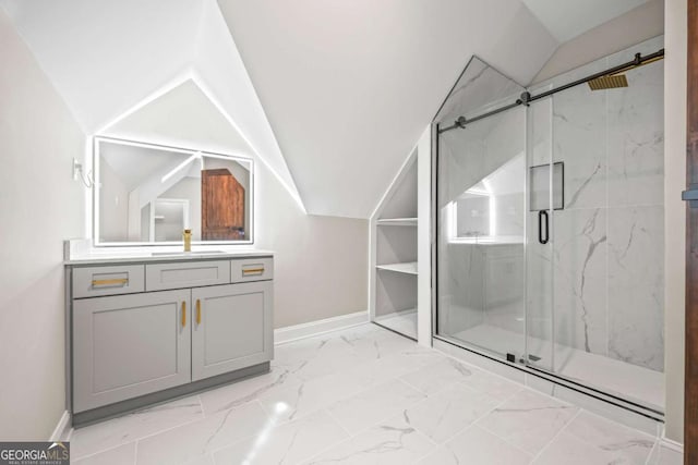 full bath featuring lofted ceiling, marble finish floor, a marble finish shower, and vanity