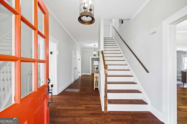 entryway featuring baseboards, stairway, dark wood-style flooring, and crown molding