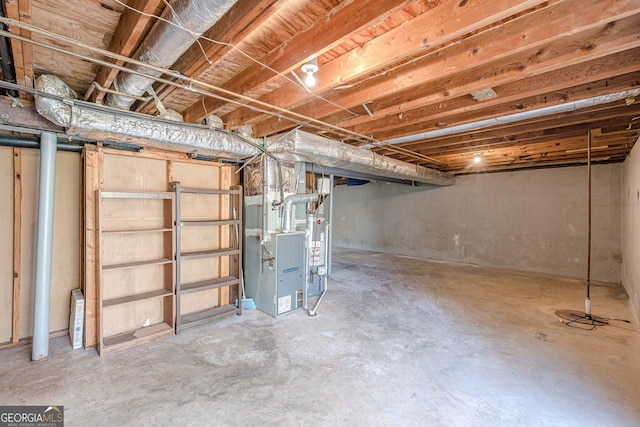 unfinished basement featuring heating unit