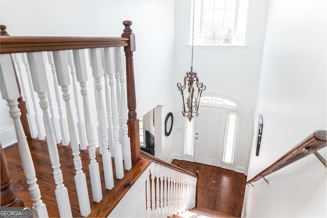 foyer entrance featuring stairs and wood finished floors