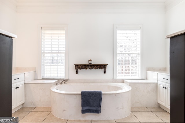 bathroom featuring a wealth of natural light, vanity, and tile patterned floors