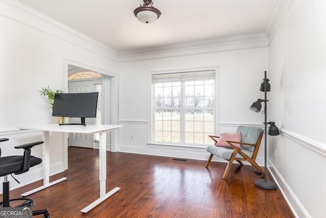 office space featuring dark wood-style floors, baseboards, visible vents, and crown molding