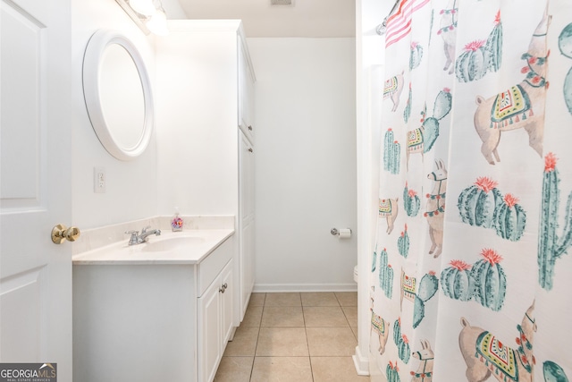 full bath with visible vents, a shower with shower curtain, toilet, tile patterned floors, and vanity