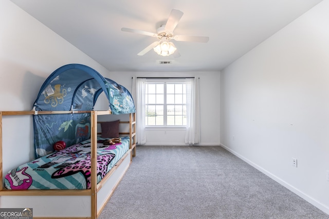 bedroom featuring ceiling fan, carpet floors, visible vents, and baseboards