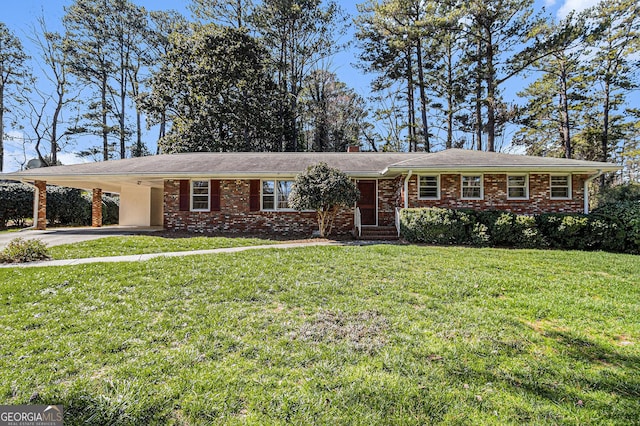 single story home with driveway, a front yard, an attached carport, and brick siding