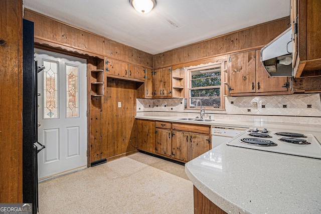 kitchen featuring open shelves, light countertops, brown cabinetry, a sink, and white appliances