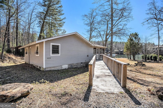 view of property exterior featuring crawl space