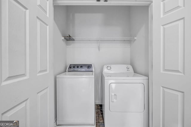 laundry room with laundry area and washing machine and clothes dryer