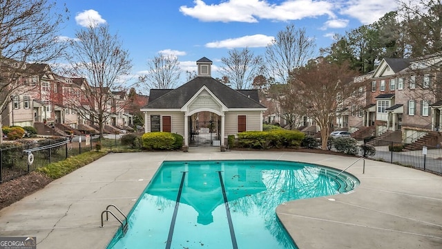 community pool featuring fence