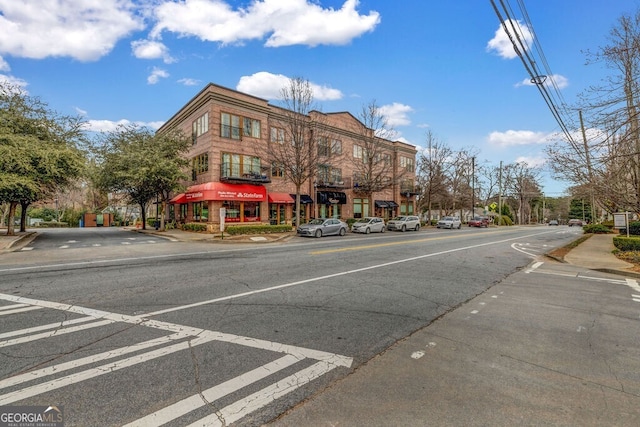 view of street with sidewalks and curbs