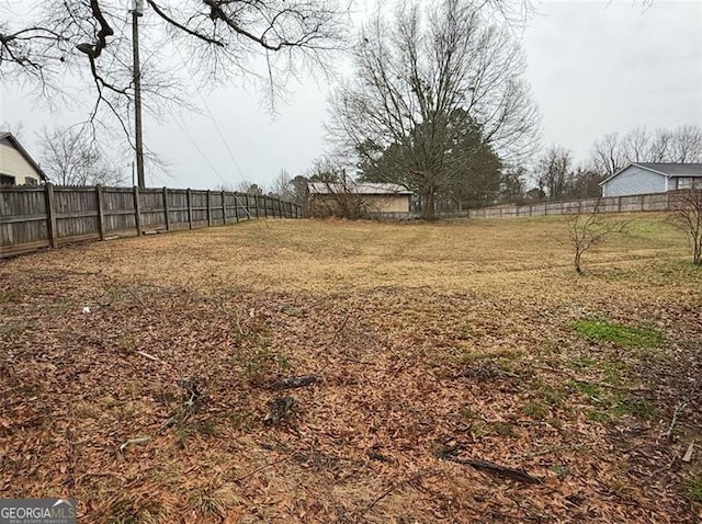 view of yard with fence