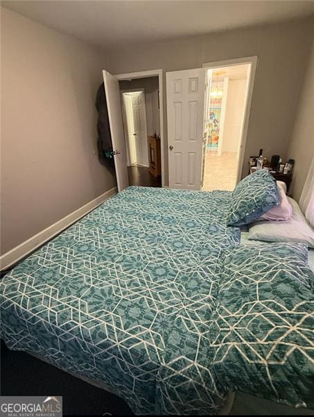 bedroom featuring baseboards