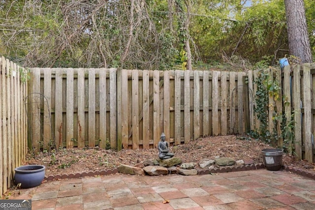 view of yard with a fenced backyard and a patio