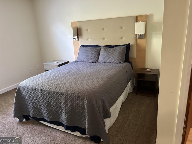 bedroom with carpet flooring and baseboards