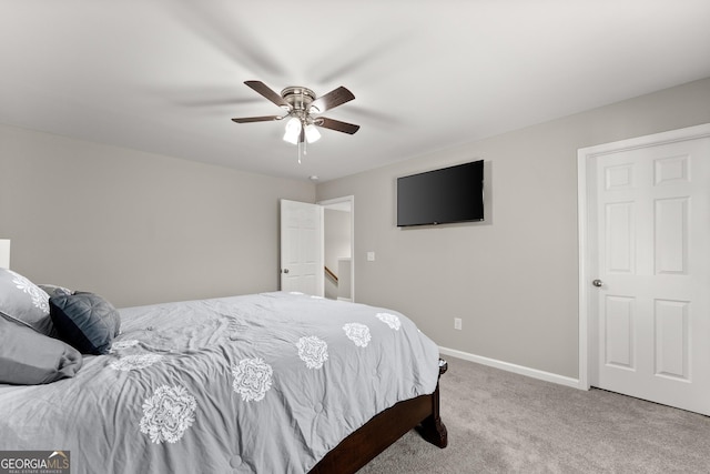 bedroom with carpet, baseboards, and ceiling fan