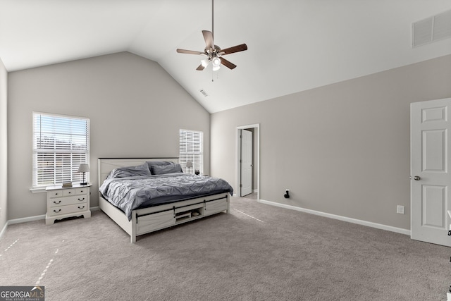 bedroom with light carpet, high vaulted ceiling, visible vents, and baseboards