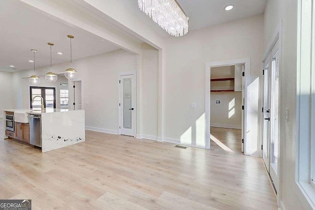 interior space featuring light wood-style floors, visible vents, and recessed lighting