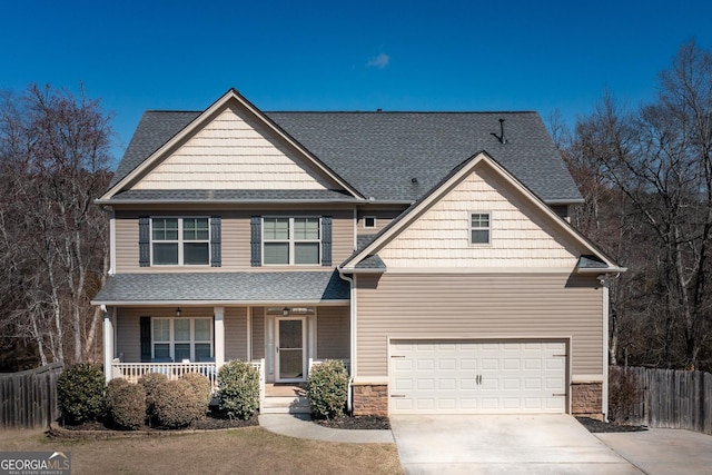 craftsman inspired home featuring driveway, a shingled roof, stone siding, fence, and a porch