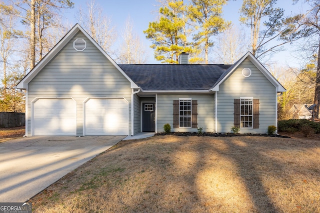 ranch-style home featuring roof with shingles, a chimney, an attached garage, driveway, and a front lawn