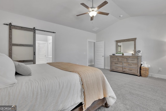 bedroom featuring light carpet, a barn door, baseboards, a ceiling fan, and vaulted ceiling