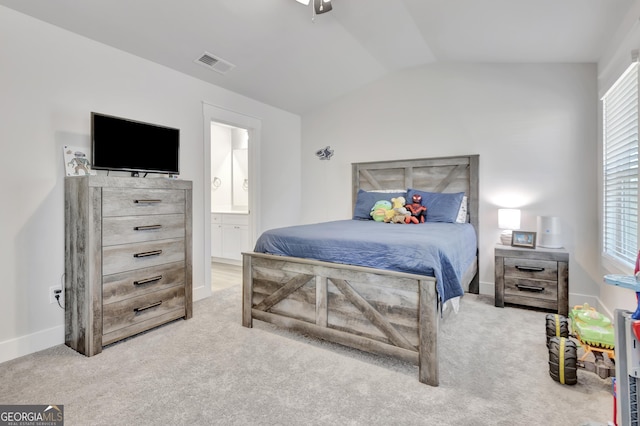 bedroom with visible vents, vaulted ceiling, light carpet, and baseboards