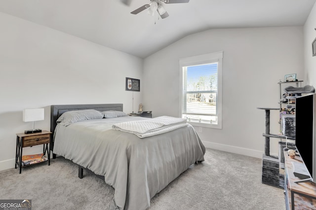 bedroom with lofted ceiling, ceiling fan, baseboards, and light colored carpet