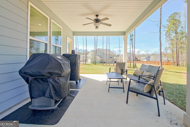 sunroom with a ceiling fan