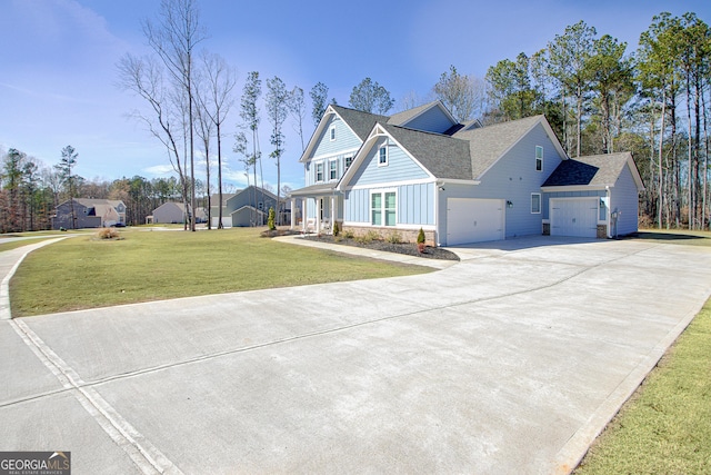 view of front of home featuring driveway, a garage, a shingled roof, a front lawn, and board and batten siding