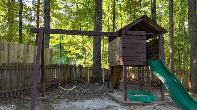 view of playground with a fenced backyard