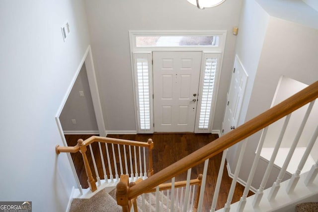 entryway with stairs and visible vents