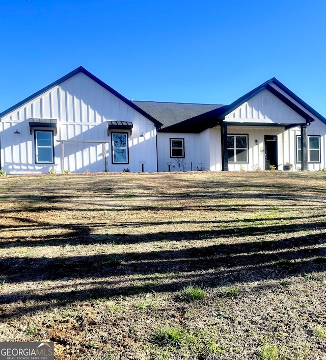 modern inspired farmhouse featuring board and batten siding