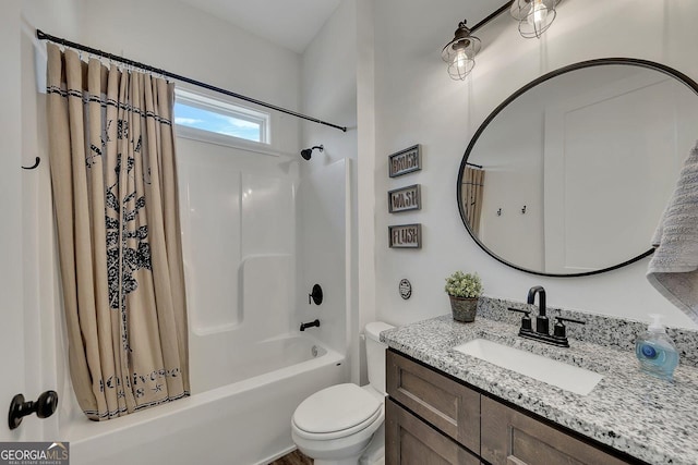 bathroom with toilet, shower / tub combo with curtain, and vanity