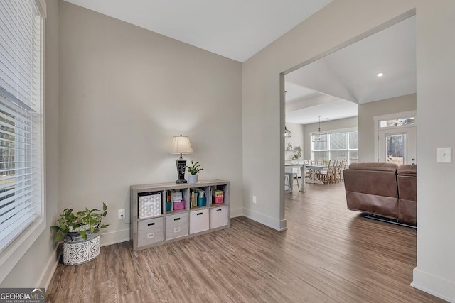 sitting room featuring baseboards and wood finished floors