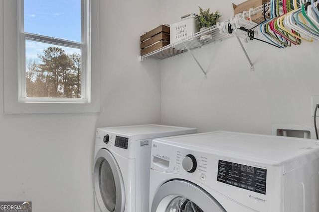 laundry area with laundry area and separate washer and dryer