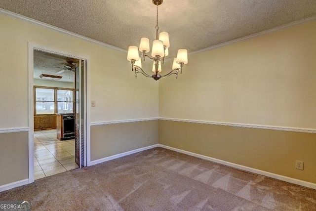 empty room featuring light carpet, crown molding, a textured ceiling, and light tile patterned floors