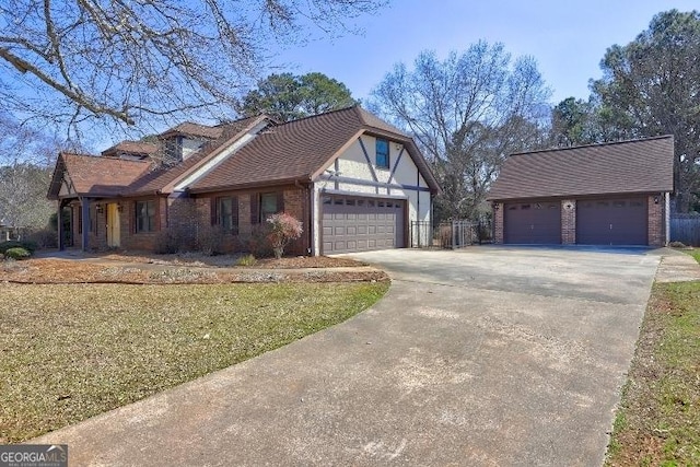 tudor home with a front lawn and brick siding