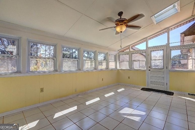 unfurnished sunroom featuring ceiling fan and vaulted ceiling