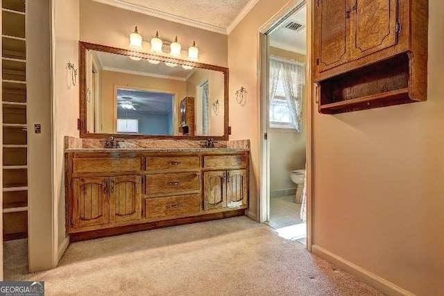 full bathroom with double vanity, carpet, visible vents, and ornamental molding