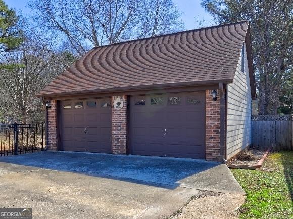 detached garage with fence