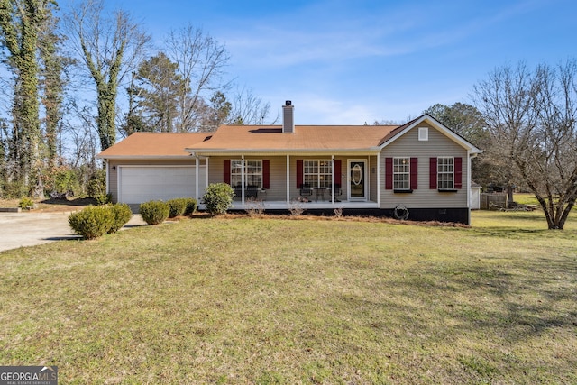 ranch-style house with a chimney, covered porch, a garage, driveway, and a front lawn